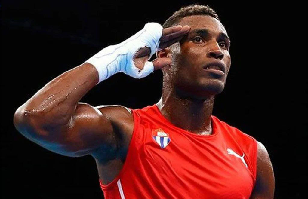 Felicita Díaz-Canel al bicampeón olímpico Julio César la Cruz